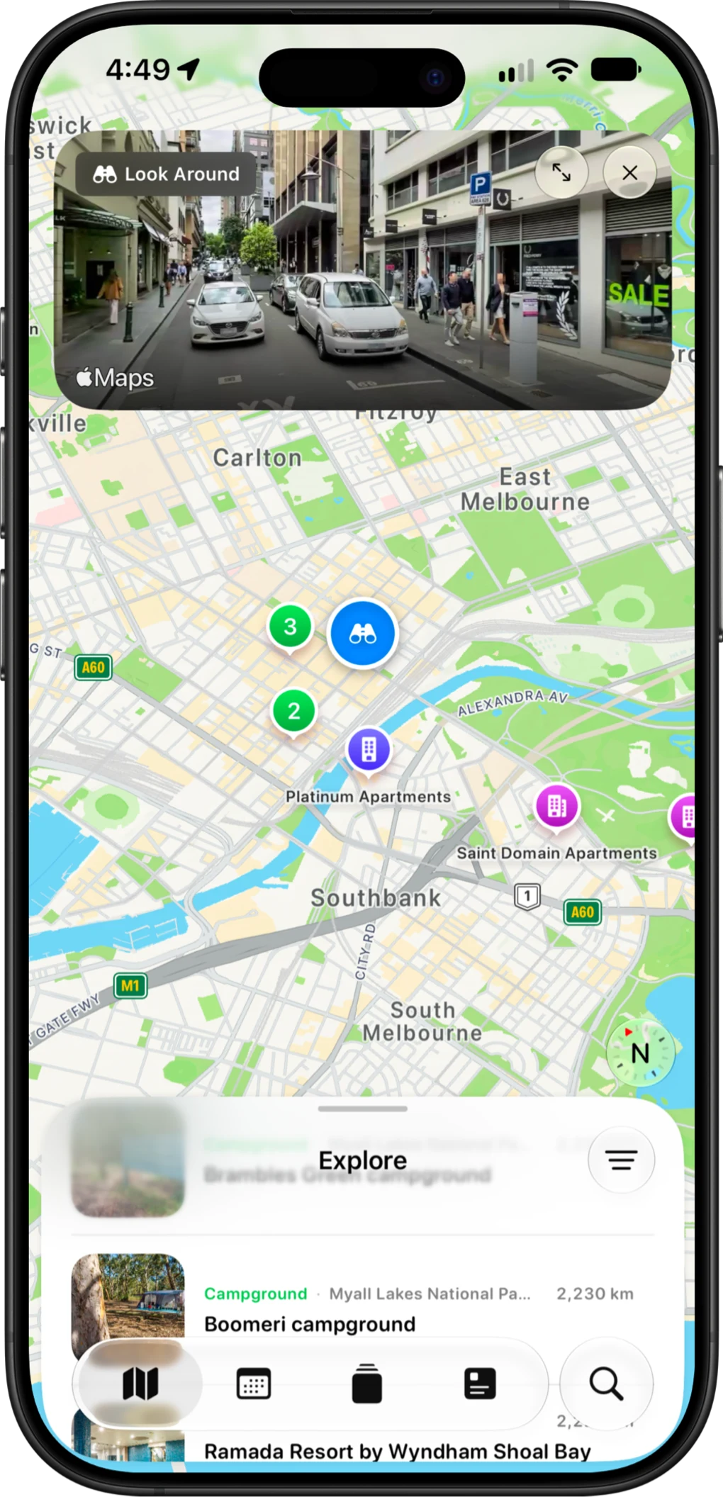 The AussieCamps Explore list showing campgrounds and caravan parks with their distance from the current map view